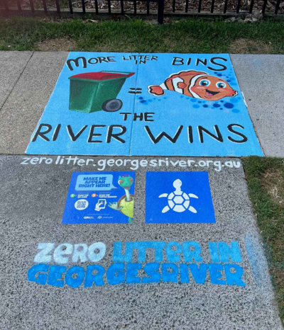 Finished artwork at Connells Point Public School showing a happy clown fish and a red bin and text "More litter in bins the river wins"