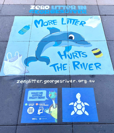 Finished artwork at Hurstville Interchange showing a blue dolphin and images of turtles and text "more litter hurts the river"