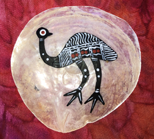 aboriginal painting of an emu inside a white circle and red background