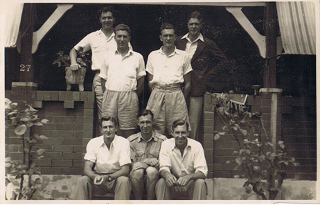 The seven Nethery sons standing and sitting at the entrance to the Nethery Family home at 27 Westbourne Street (later Anglo Square), Carlton NSW, ca 1946
