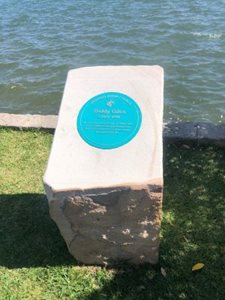 Restored Biddy Giles marker Biddy Giles restored historical marker in sandstone plinth at edge of water in Endeavour Reserve