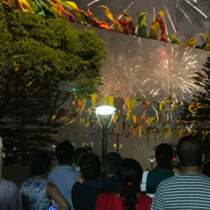 Crowds of people looking up at fireworks at an Australia Day event held in 2022