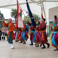 Dancers in Lebanese traditional costumes on a stage performing