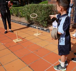 child playing with rings in the courtyard