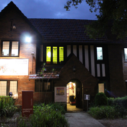 External view of Hurstville Museum & Gallery open to the public at night