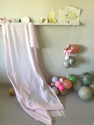 set up with balloons and pink fabric