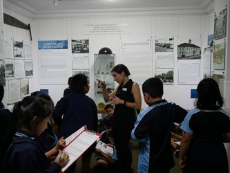 students on a excursion filling out a working sheet