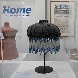 A beaded white and blue lamp on display at Hurstville Museum & Gallery
